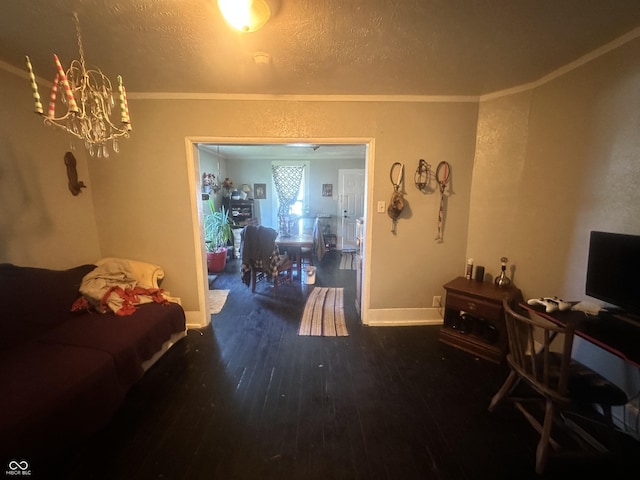 living room with a textured ceiling, a notable chandelier, dark hardwood / wood-style flooring, and crown molding