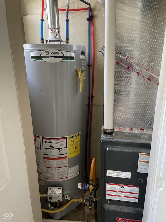 utility room with heating unit and water heater