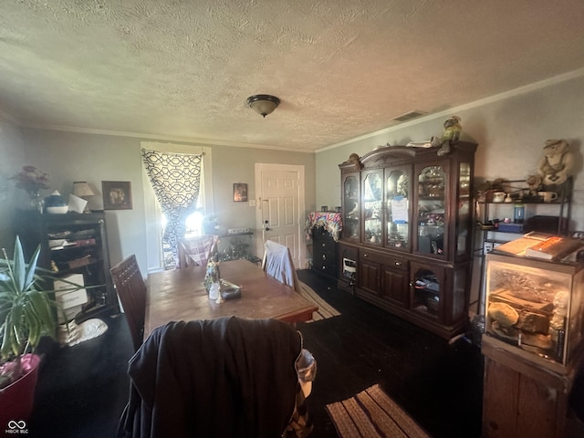 dining area featuring a textured ceiling