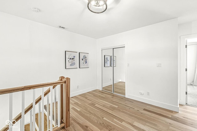 spare room featuring light wood-type flooring