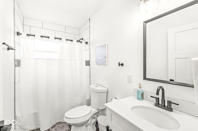 bathroom with vanity, a shower with shower curtain, and toilet