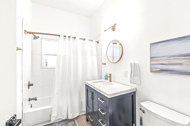 full bathroom featuring vanity, wood-type flooring, shower / tub combo, and toilet