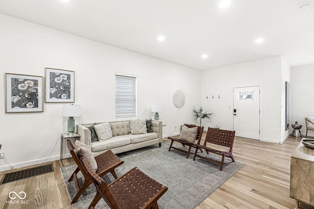 living room with light hardwood / wood-style floors