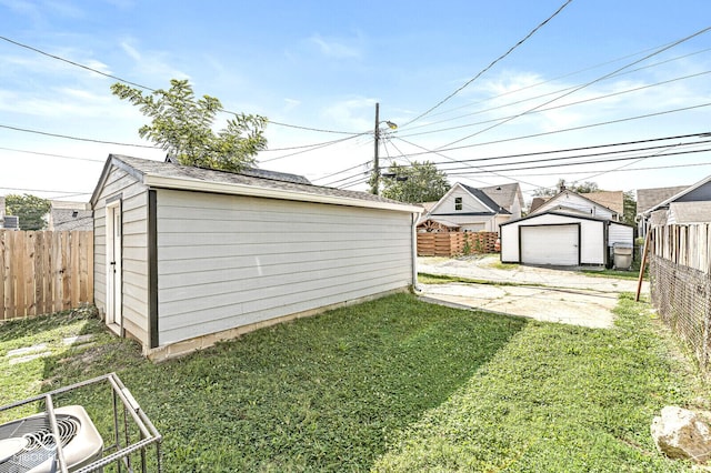 view of yard with cooling unit and an outbuilding