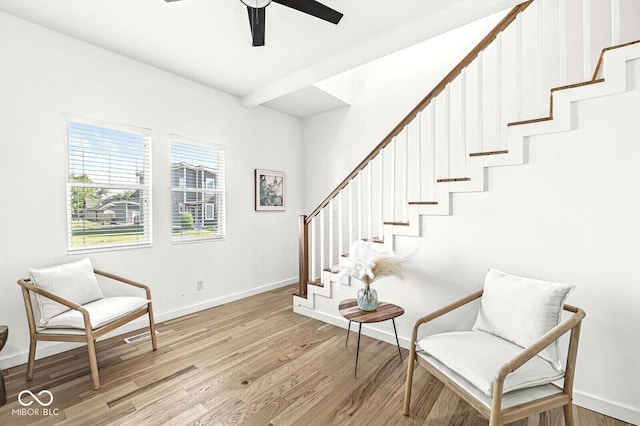 sitting room featuring ceiling fan and light wood-type flooring