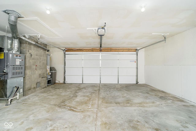 garage with a garage door opener and water heater