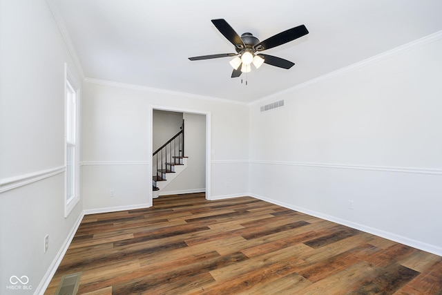 unfurnished room with dark wood-type flooring, ceiling fan, and crown molding