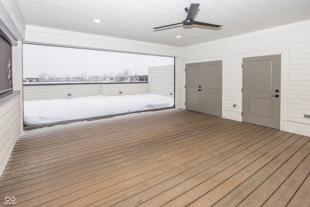 wooden terrace featuring ceiling fan