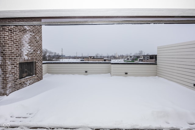 view of yard layered in snow