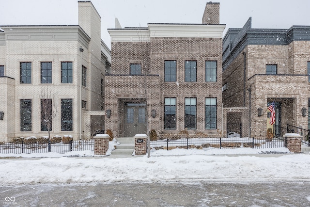 view of snow covered property