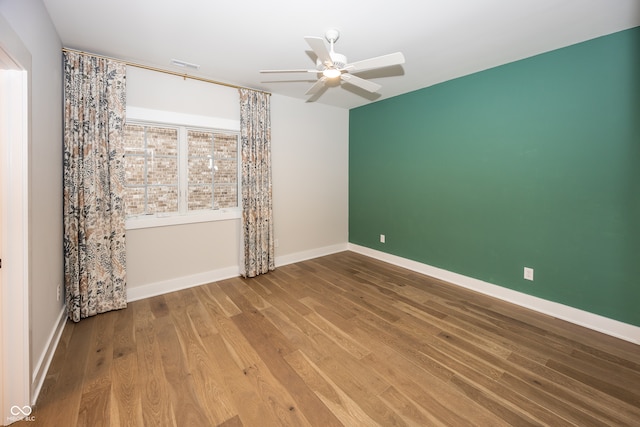 unfurnished room featuring ceiling fan and wood-type flooring