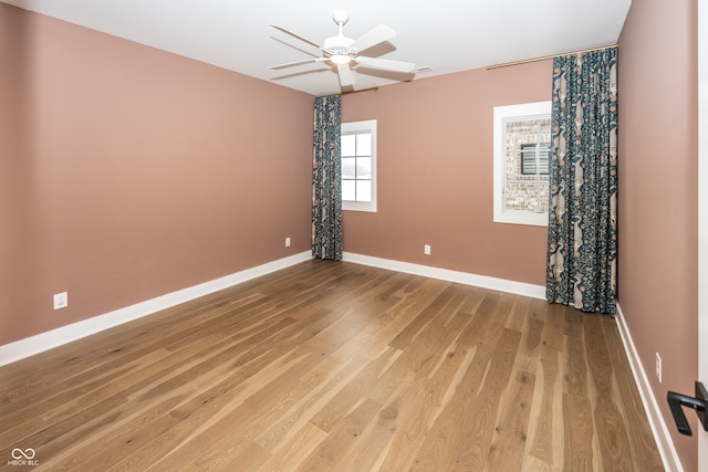 empty room with hardwood / wood-style floors