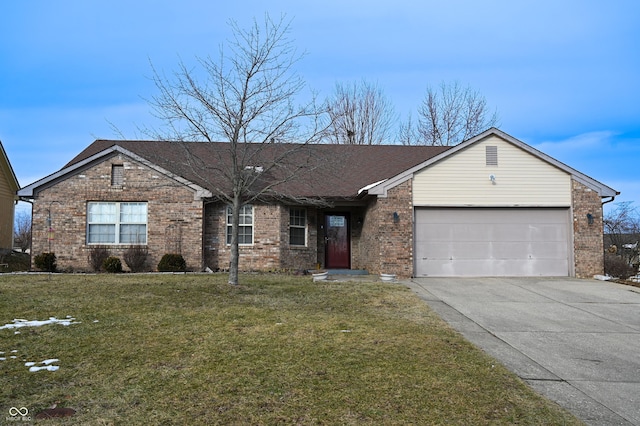 ranch-style house featuring a garage and a front yard