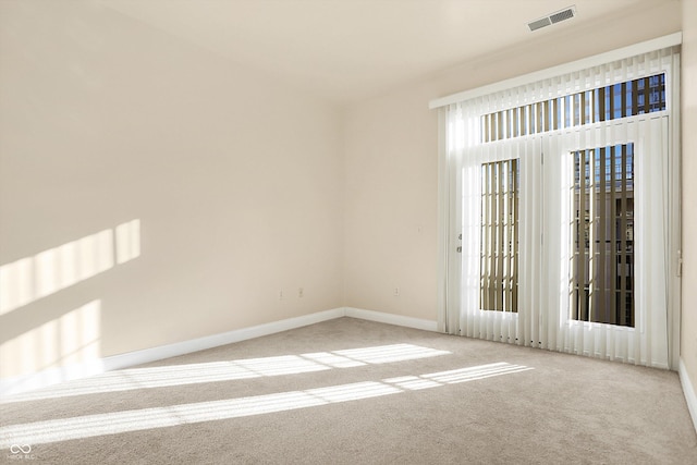 unfurnished room featuring carpet floors