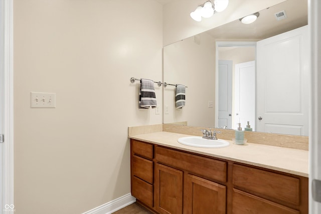 bathroom featuring tile patterned floors and vanity