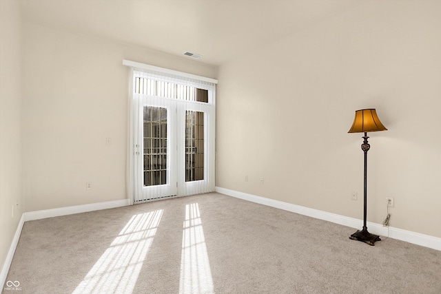 empty room with light colored carpet