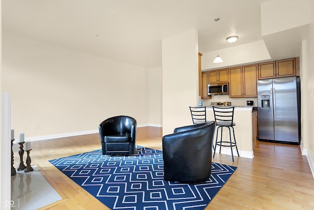 living area with wood-type flooring