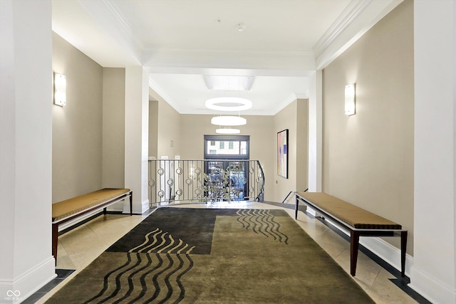 hall featuring light tile patterned floors and ornamental molding