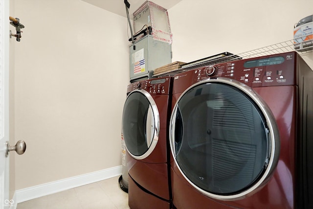 washroom featuring washer and clothes dryer