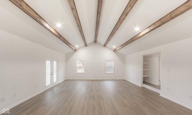 interior space featuring vaulted ceiling with beams, french doors, and dark hardwood / wood-style flooring