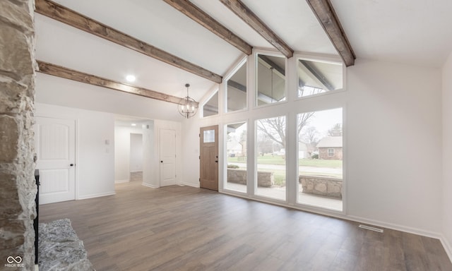 unfurnished living room featuring hardwood / wood-style floors, beamed ceiling, a chandelier, and high vaulted ceiling