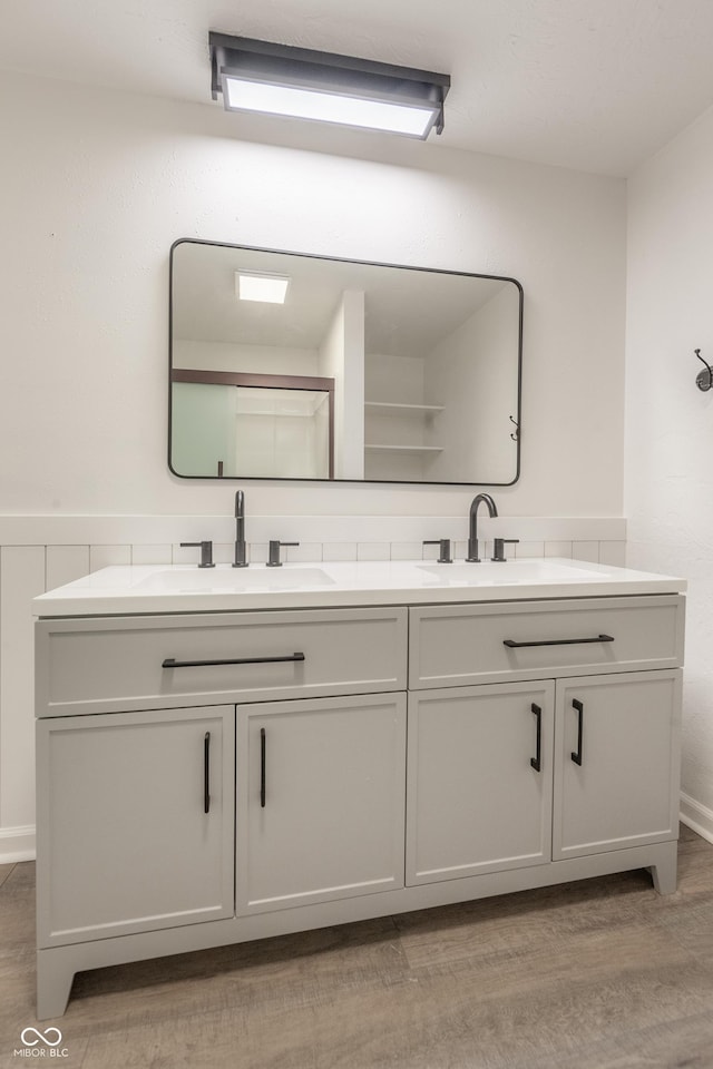 bathroom featuring vanity and hardwood / wood-style flooring