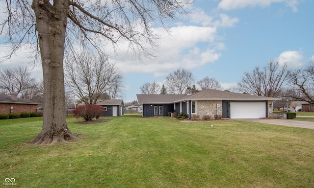 ranch-style home featuring a garage and a front lawn