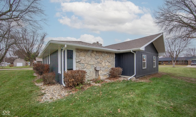 view of side of property featuring a yard