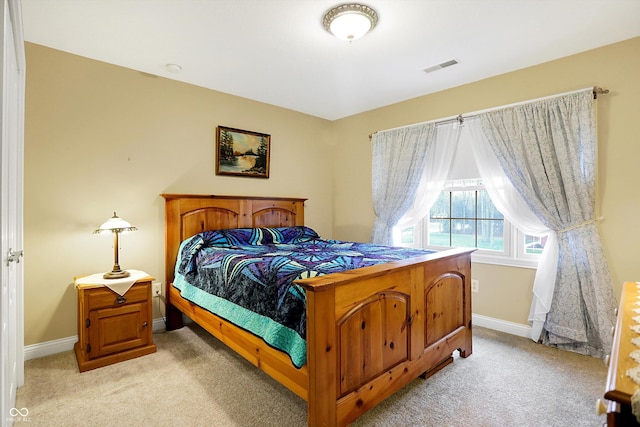 bedroom with light carpet