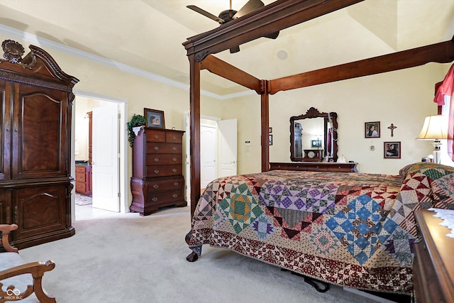 carpeted bedroom with ceiling fan and ornamental molding