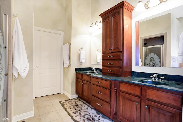 bathroom with tile patterned flooring and vanity