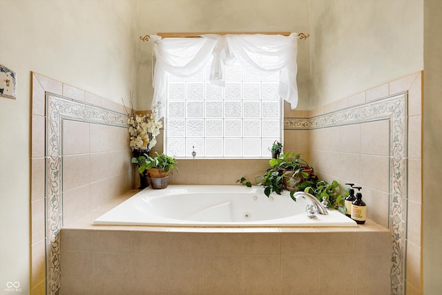 bathroom with tiled bath