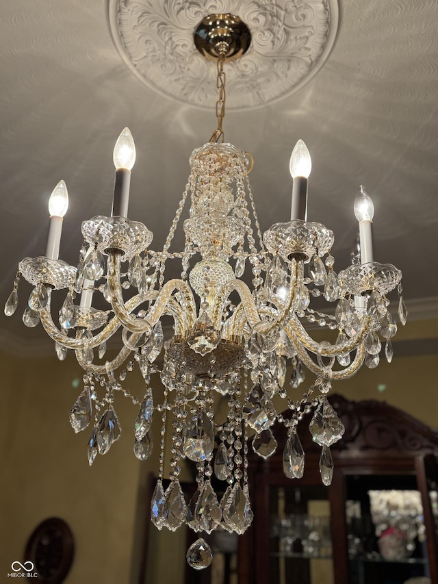 interior details featuring a notable chandelier