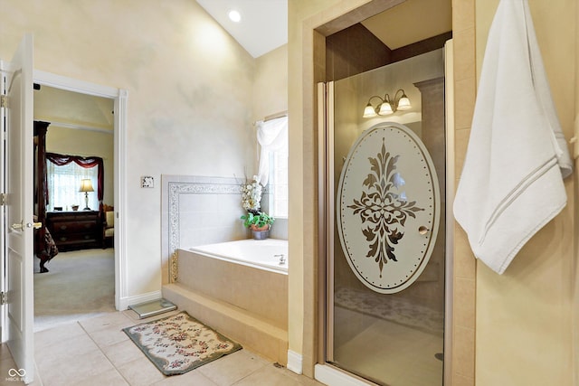 bathroom featuring tile patterned flooring, vaulted ceiling, and plus walk in shower