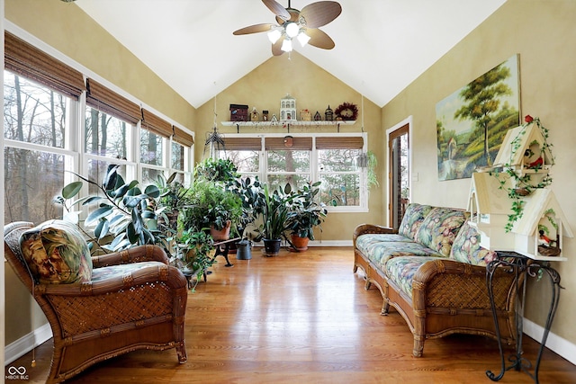 sunroom featuring ceiling fan and vaulted ceiling