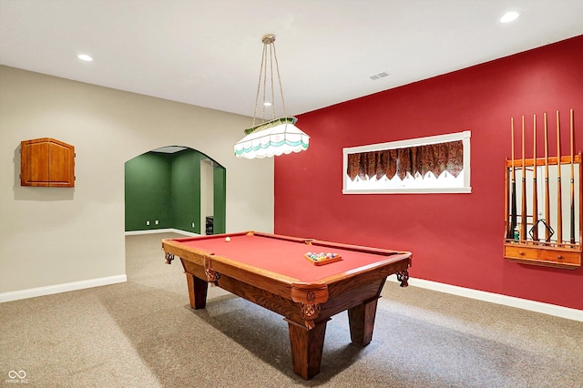 rec room with visible vents, arched walkways, baseboards, and carpet floors