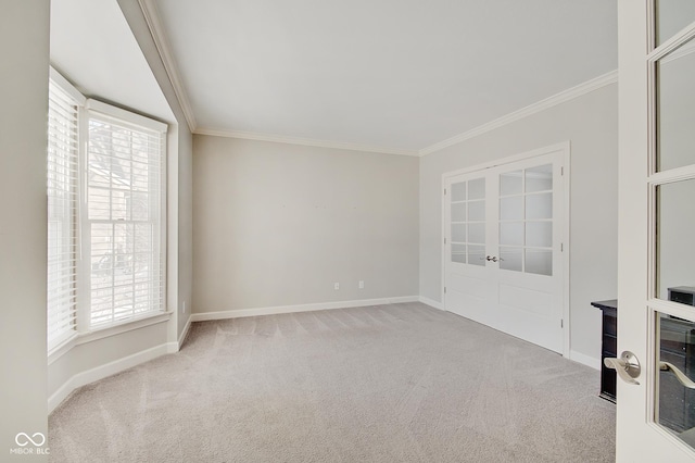 carpeted spare room with crown molding, french doors, beverage cooler, and a healthy amount of sunlight