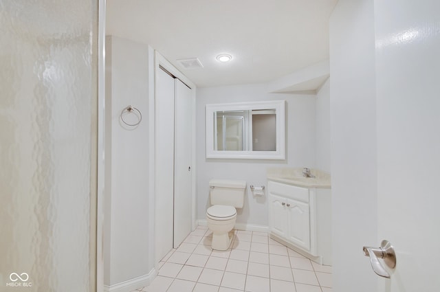 bathroom featuring tile patterned flooring, vanity, and toilet