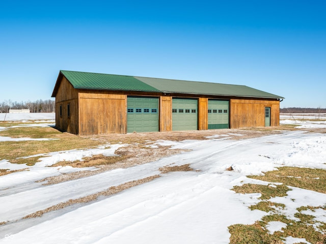 view of snow covered garage