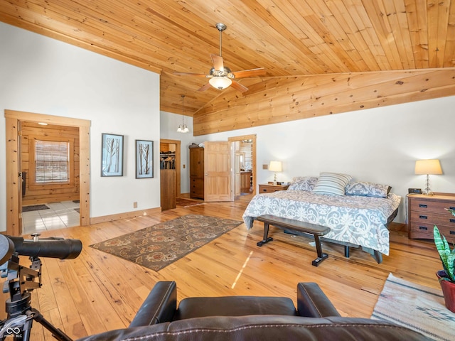 bedroom featuring wood ceiling, high vaulted ceiling, ceiling fan, and light wood-type flooring