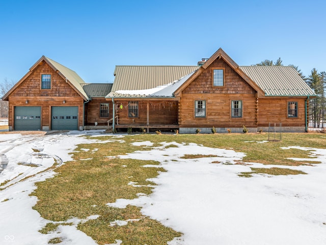 log cabin featuring a garage