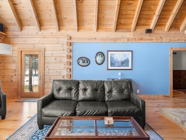 living room featuring vaulted ceiling with beams, hardwood / wood-style floors, wooden ceiling, and wooden walls