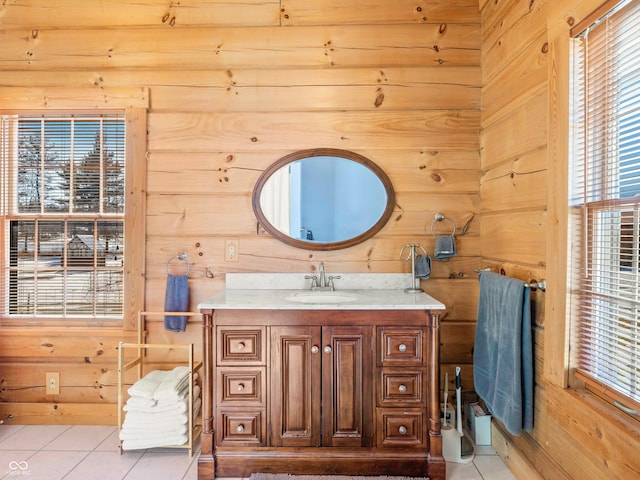 bathroom with vanity, tile patterned floors, and wood walls