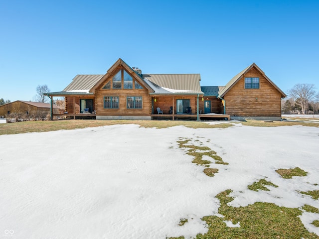 log cabin featuring a porch