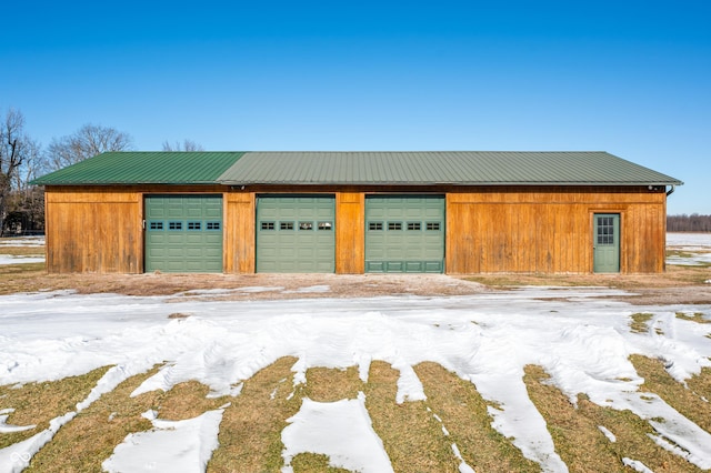 view of snow covered garage