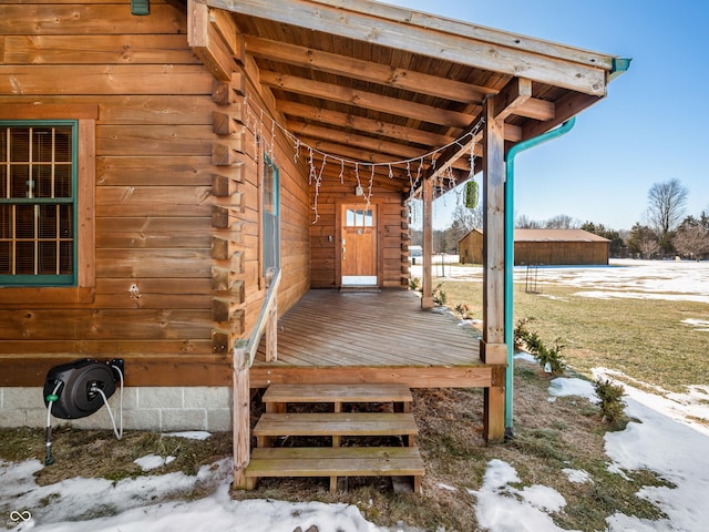 view of snow covered deck