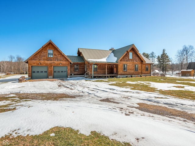 log home featuring a garage