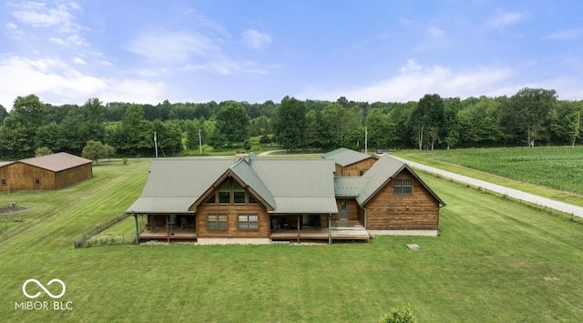 4210 S County Road 400 E, North Vernon, IN 47265 - view of front of property featuring a front yard, a forest view, and a metal roof