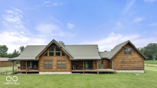 4210 S County Road 400 E, North Vernon, IN 47265 - back of house featuring a yard, a chimney, a metal roof, and a porch