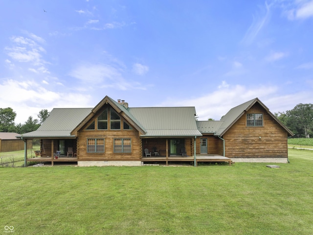 4210 S County Road 400 E, North Vernon, IN 47265 - back of house featuring a lawn, a chimney, and a metal roof
